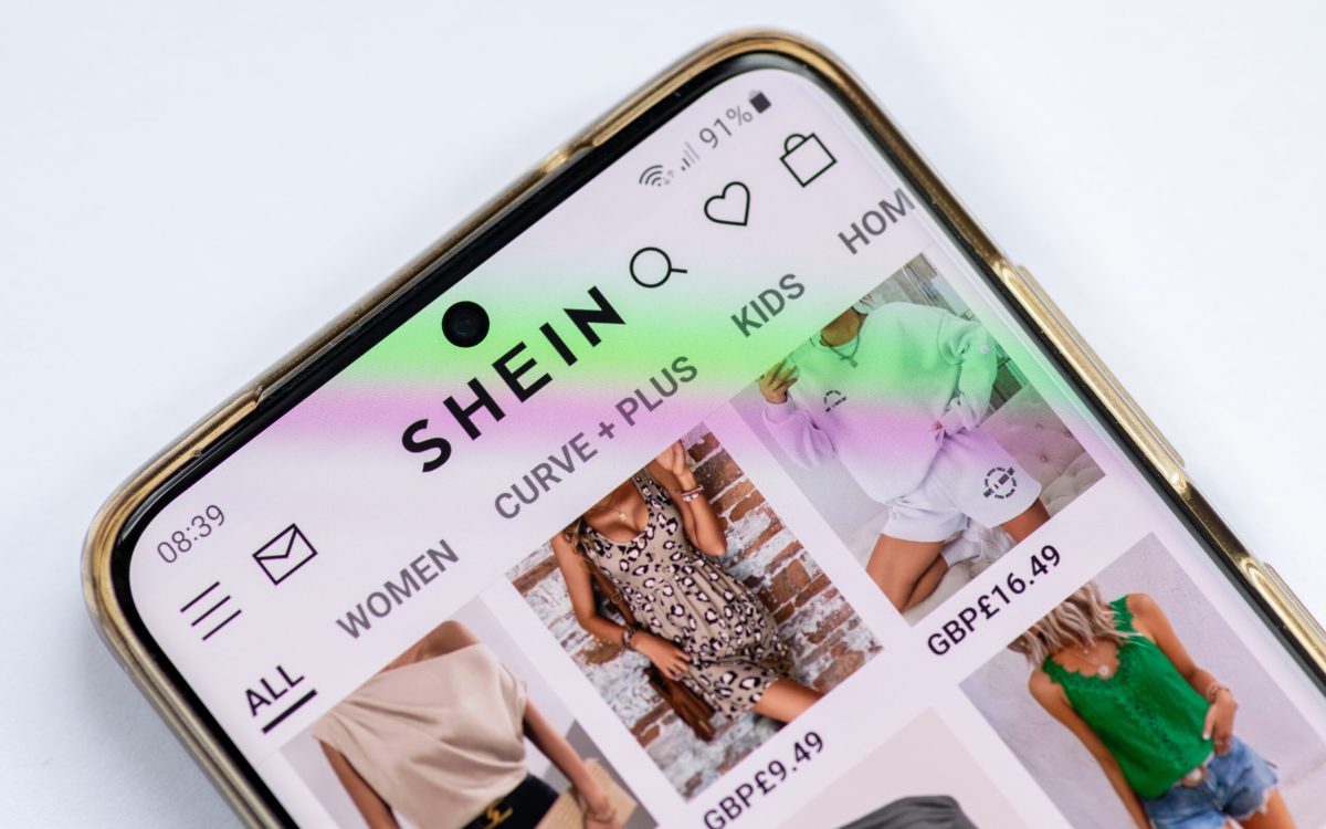 London. UK- 08.01.2023. The online wed pages of the fast fashion retailer giant Shein on a smartphone.