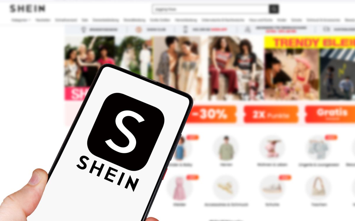 Stuttgart, Germany - May 1, 2024: Shein logo online marketplace ecommerce on a mobile phone and computer in Stuttgart, Germany.